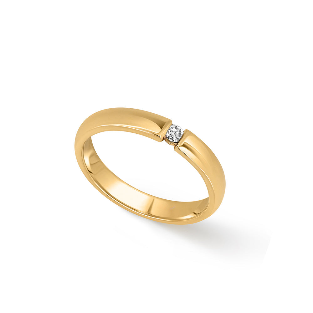 A gold ring set with a round diamond weighing 5 points