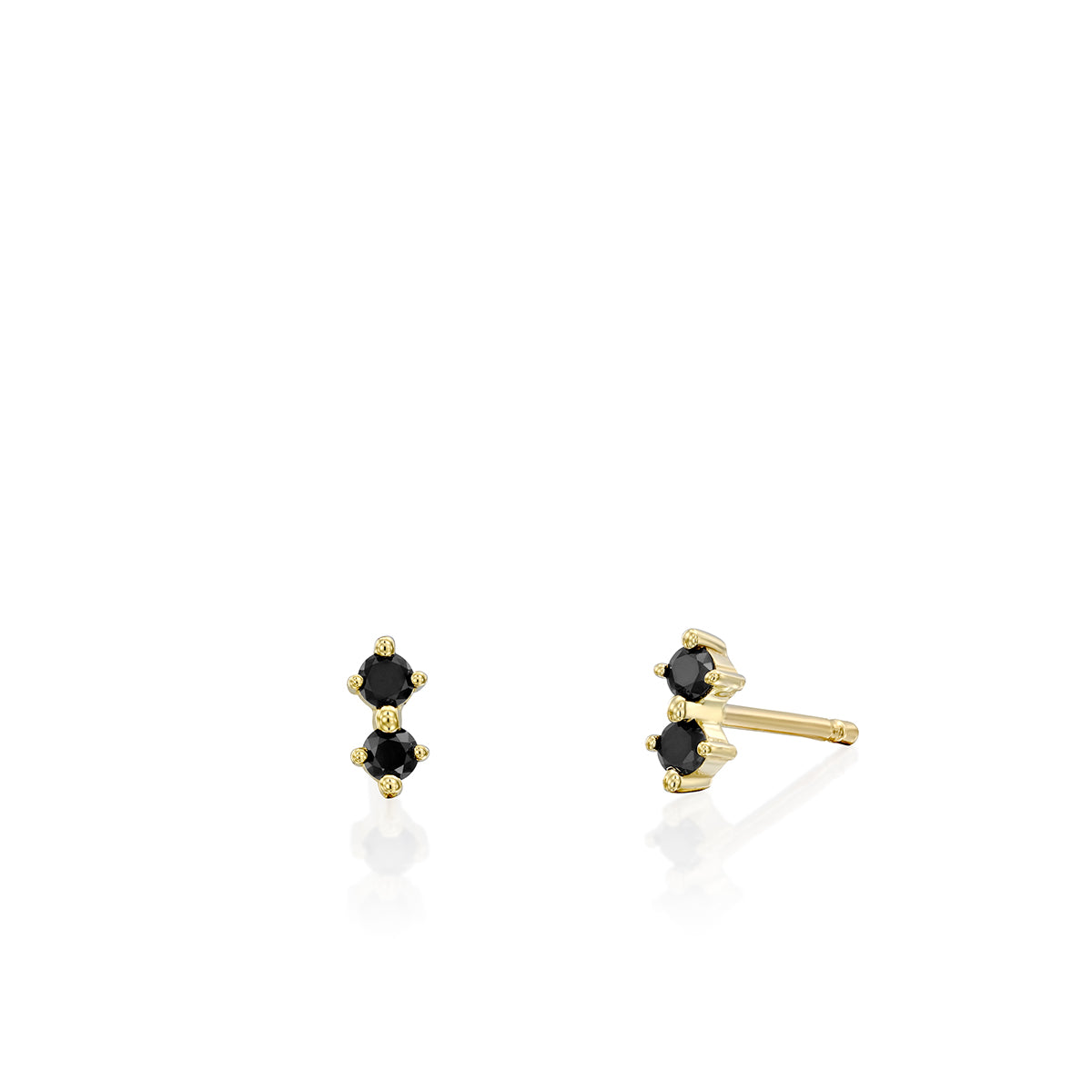 Tight gold earrings studded with two black diamonds