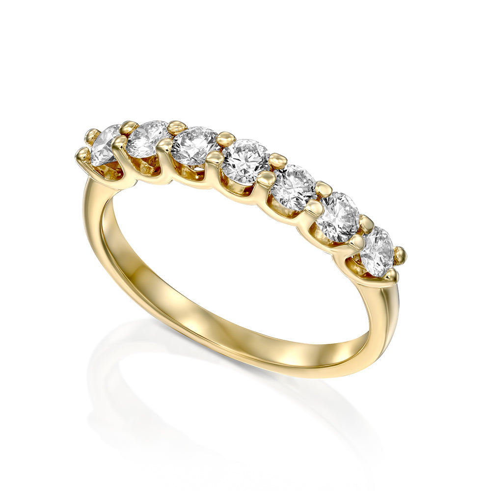 Gold ring set with 7 laboratory diamonds weighing 10 points per diamond, 70 points total