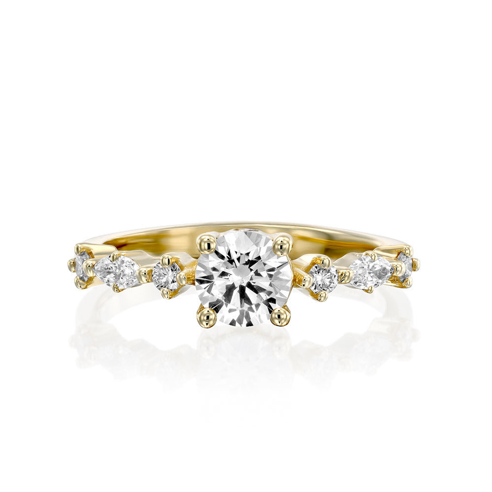 An impressive lab diamond ring set with a central round lab diamond combined with marquise-cut lab diamonds and round diamonds