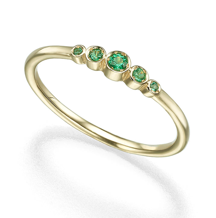 A delicate emerald ring