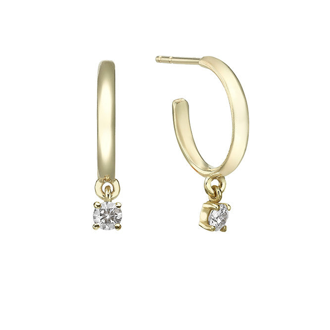 Gold hoop earrings with 20 point diamonds inlaid with teeth