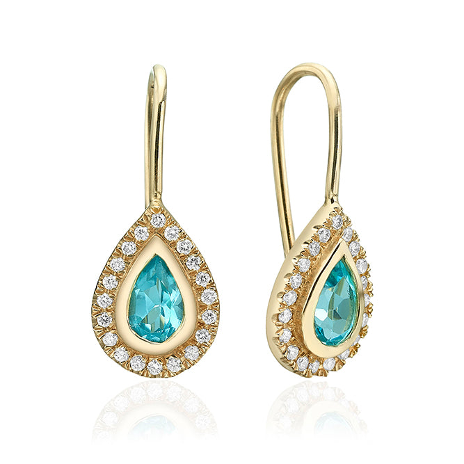 Hanging gold earrings studded with blue topaz and diamonds