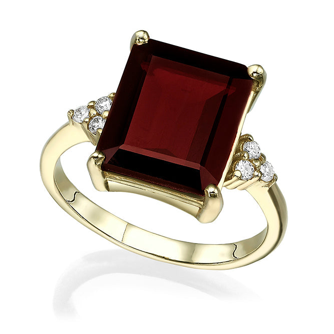 An engagement ring set with a rectangular garnet and 6 sided diamonds