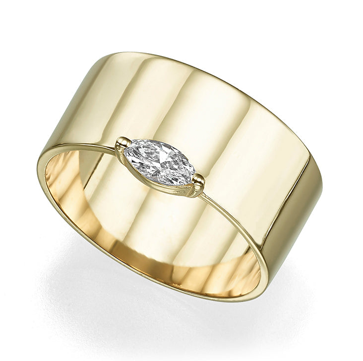 A wide gold ring set with a marquise-cut diamond
