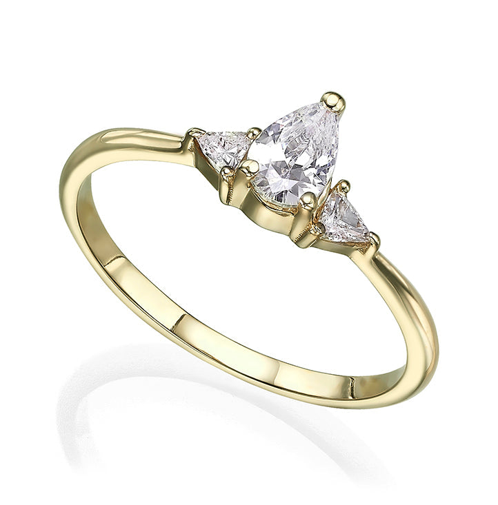 An engagement ring set with a central drop-cut diamond and triangular-cut diamonds on the sides