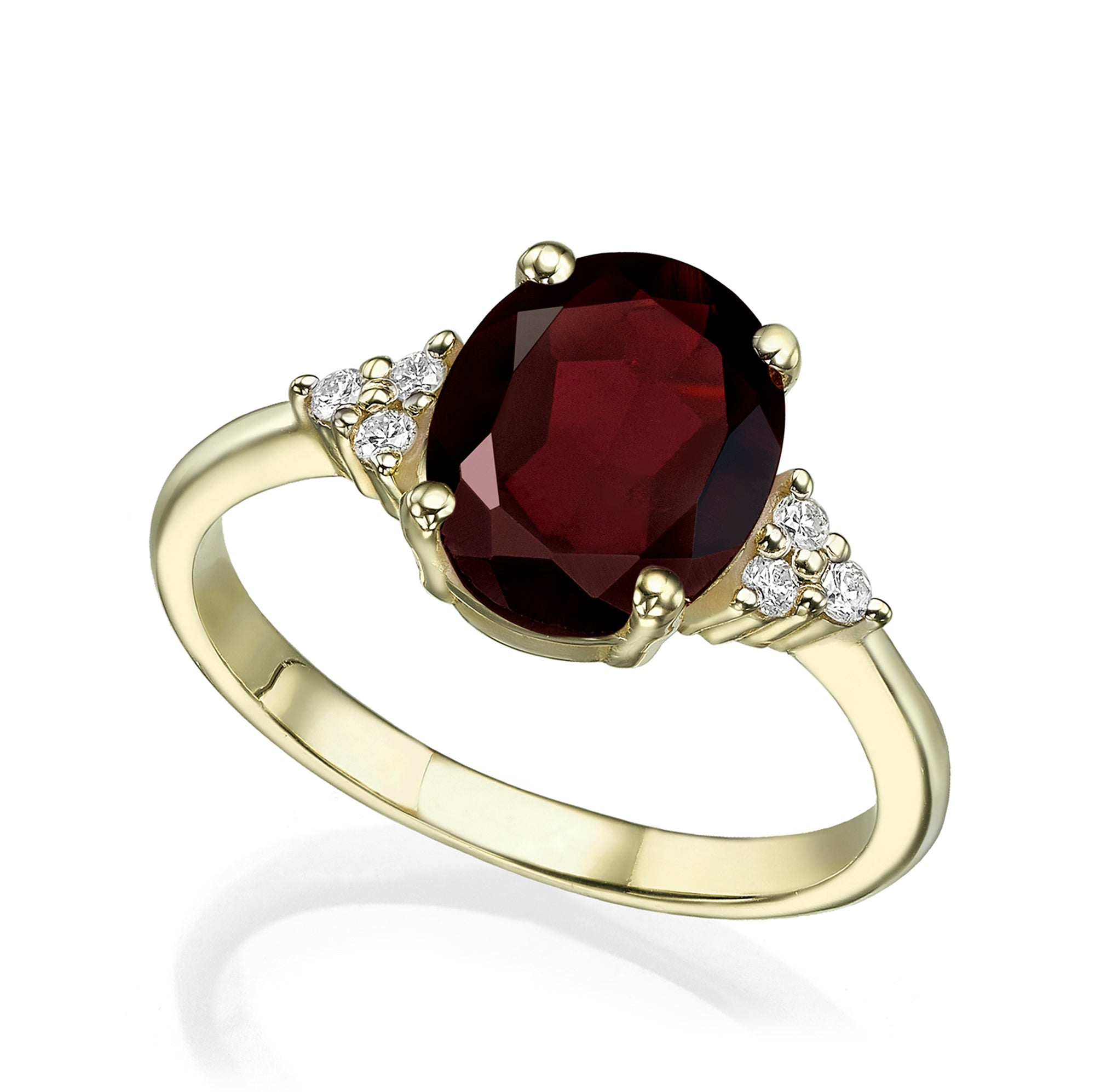 A gold ring set with an oval-cut garnet and diamonds