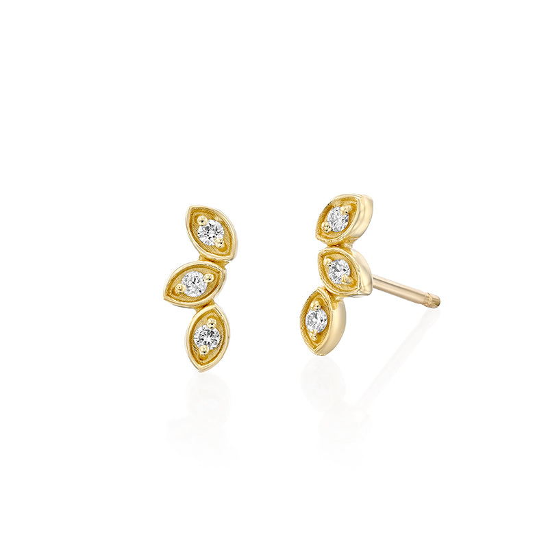 Climbing gold earrings in the shape of three leaves, set with diamonds