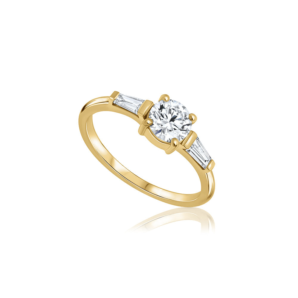 Engagement ring set with lab diamonds, a central round lab diamond, 0.70ct and two taper cut lab diamonds