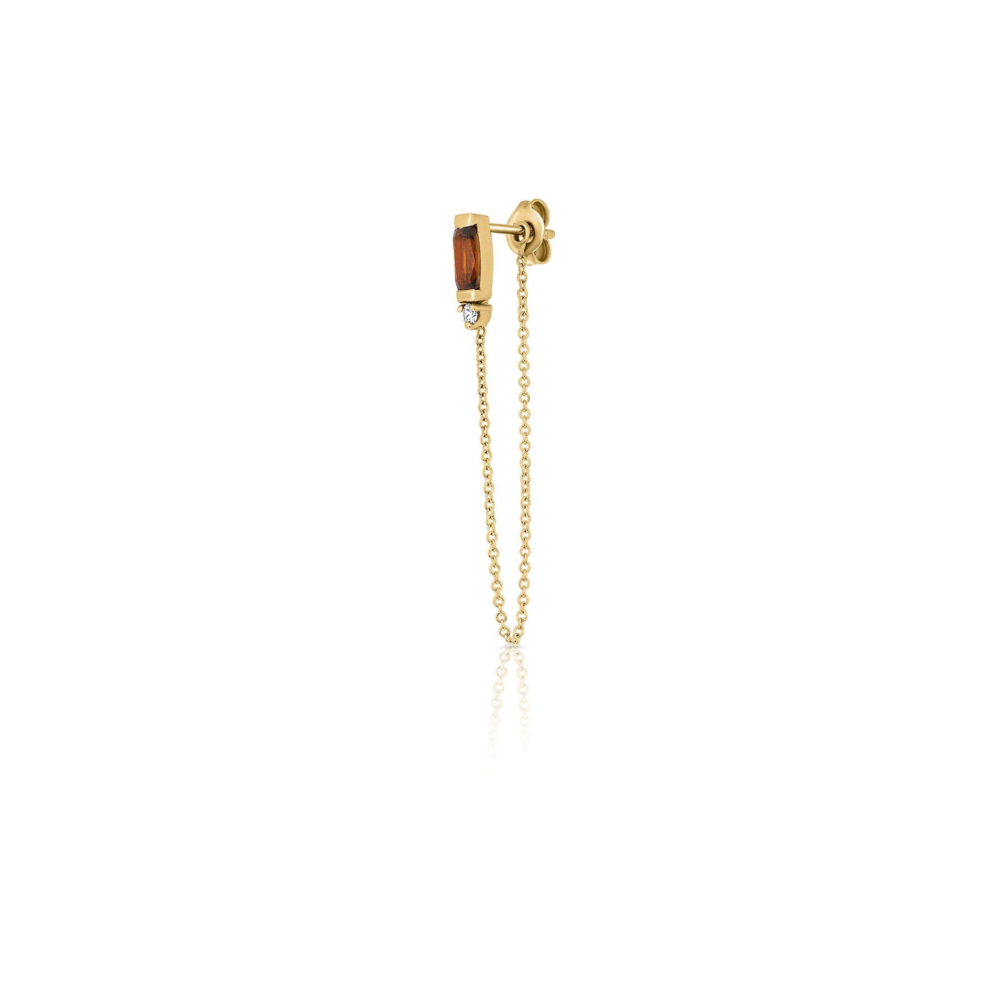 A special gold chain earring studded with gemstone, tourmaline and diamond