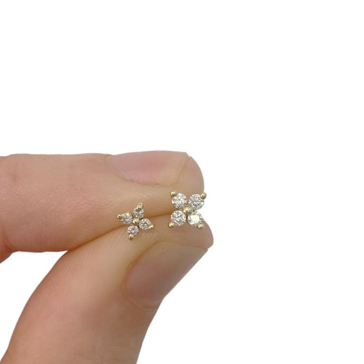 Tight gold earrings set with 4 white diamonds