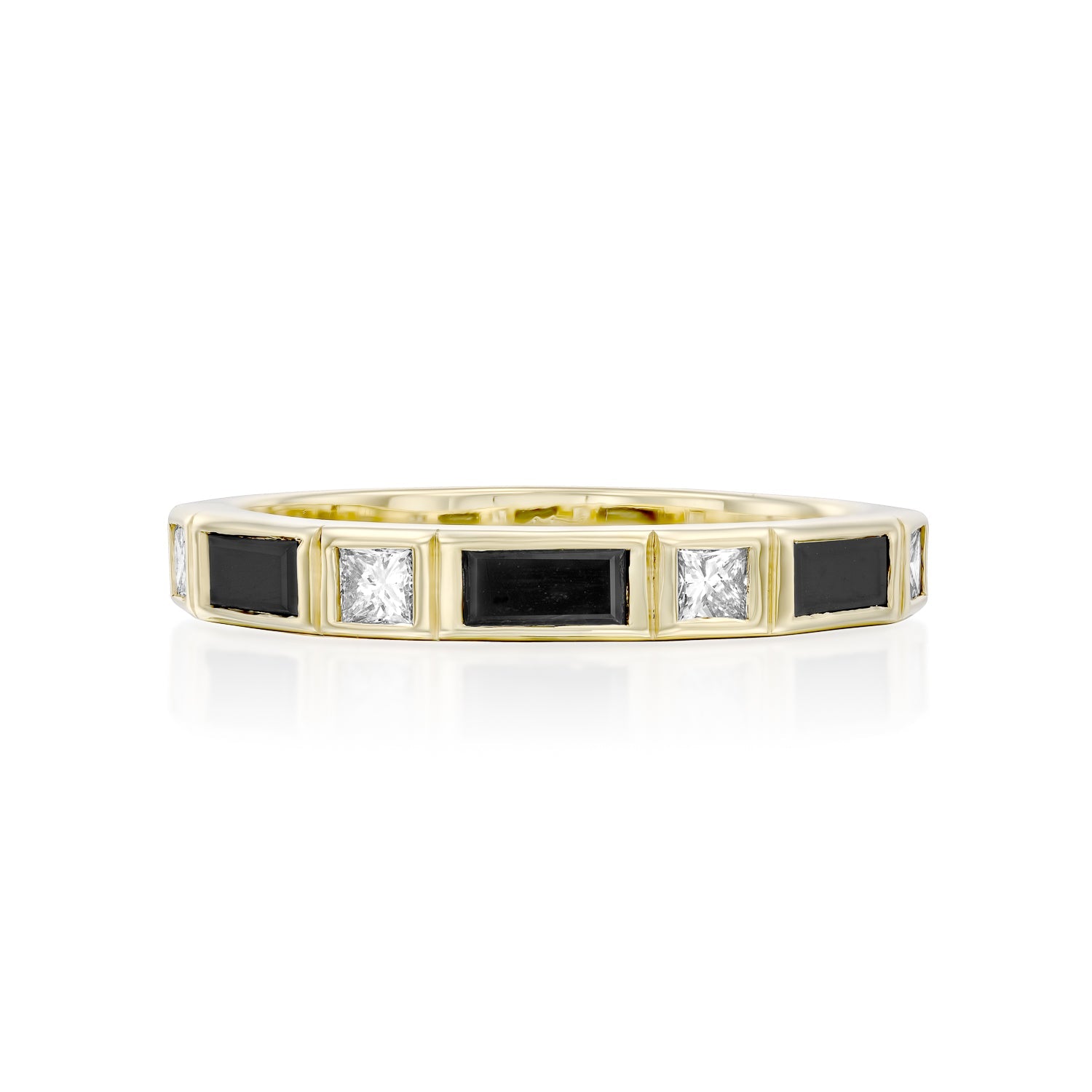 A semi-eternity ring set with baguette-cut black diamonds and princess-cut white diamonds