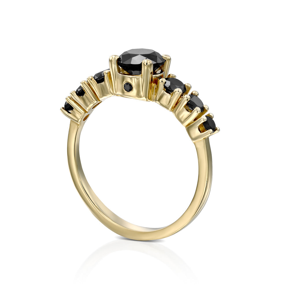 A black diamond ring for a woman set with a 1 carat central diamond and 6 side black diamonds