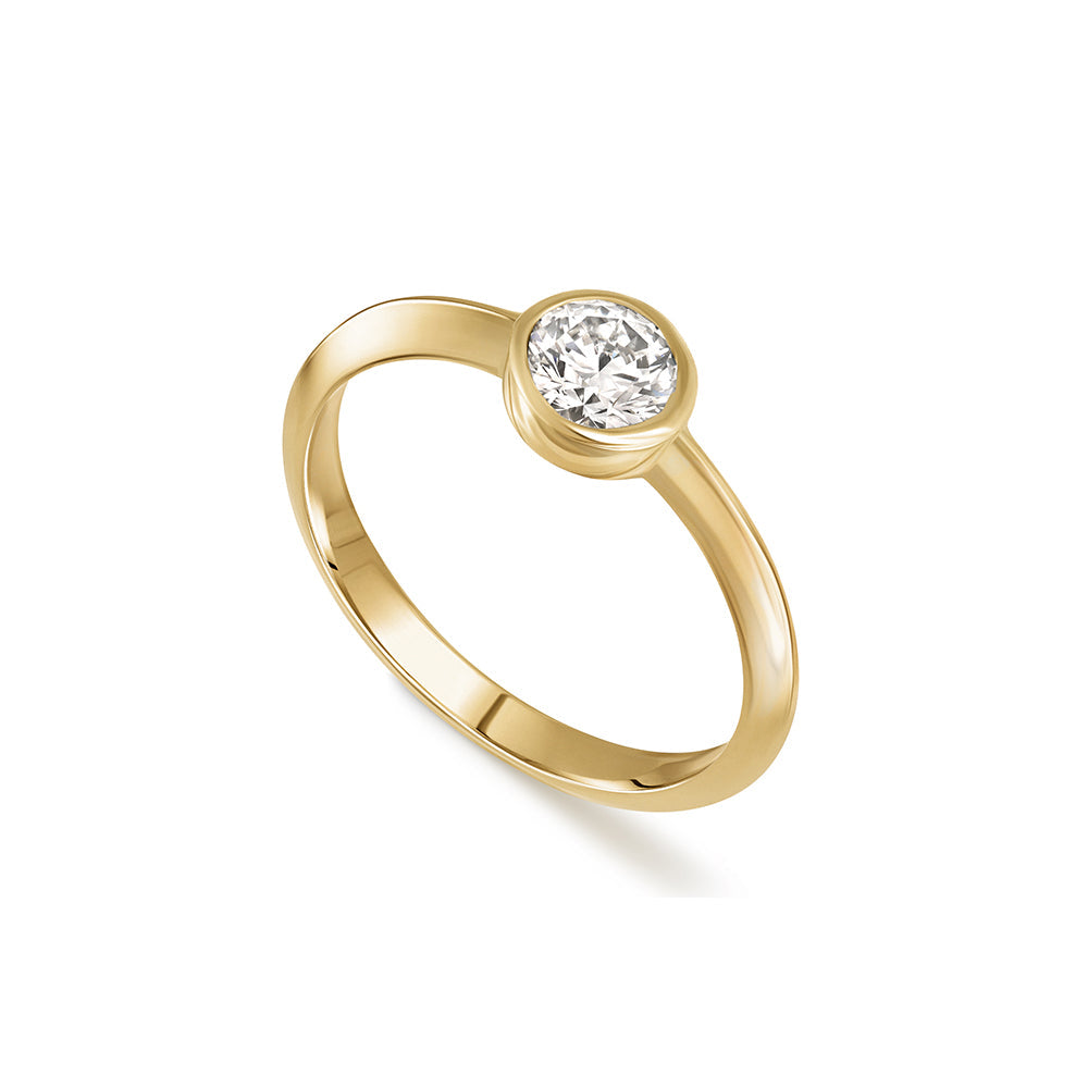 A solitaire ring set with a half carat laboratory diamond in a gold frame.