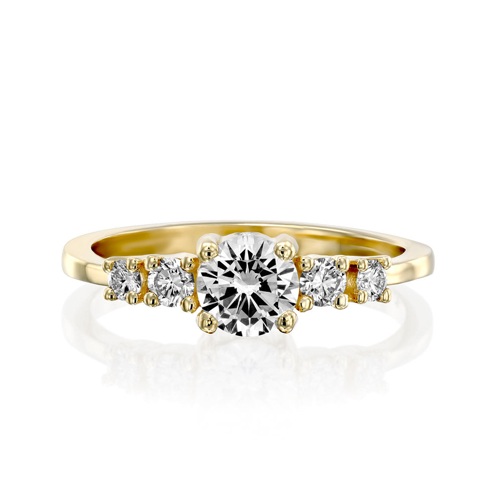An engagement ring set with a central round lab diamond and 4 side lab diamonds