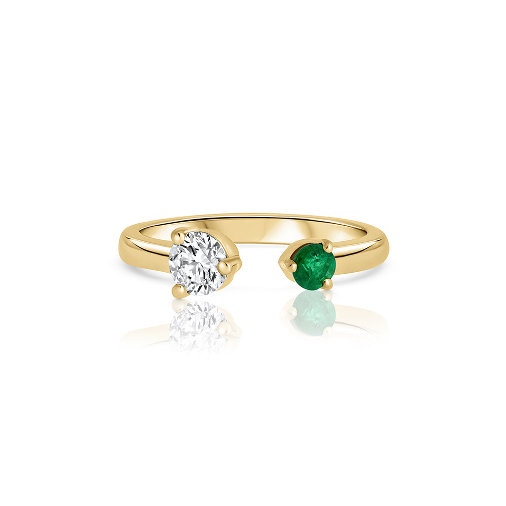 Open gold and diamond ring. A ring set with a laboratory diamond weighing 30 points and a natural emerald.