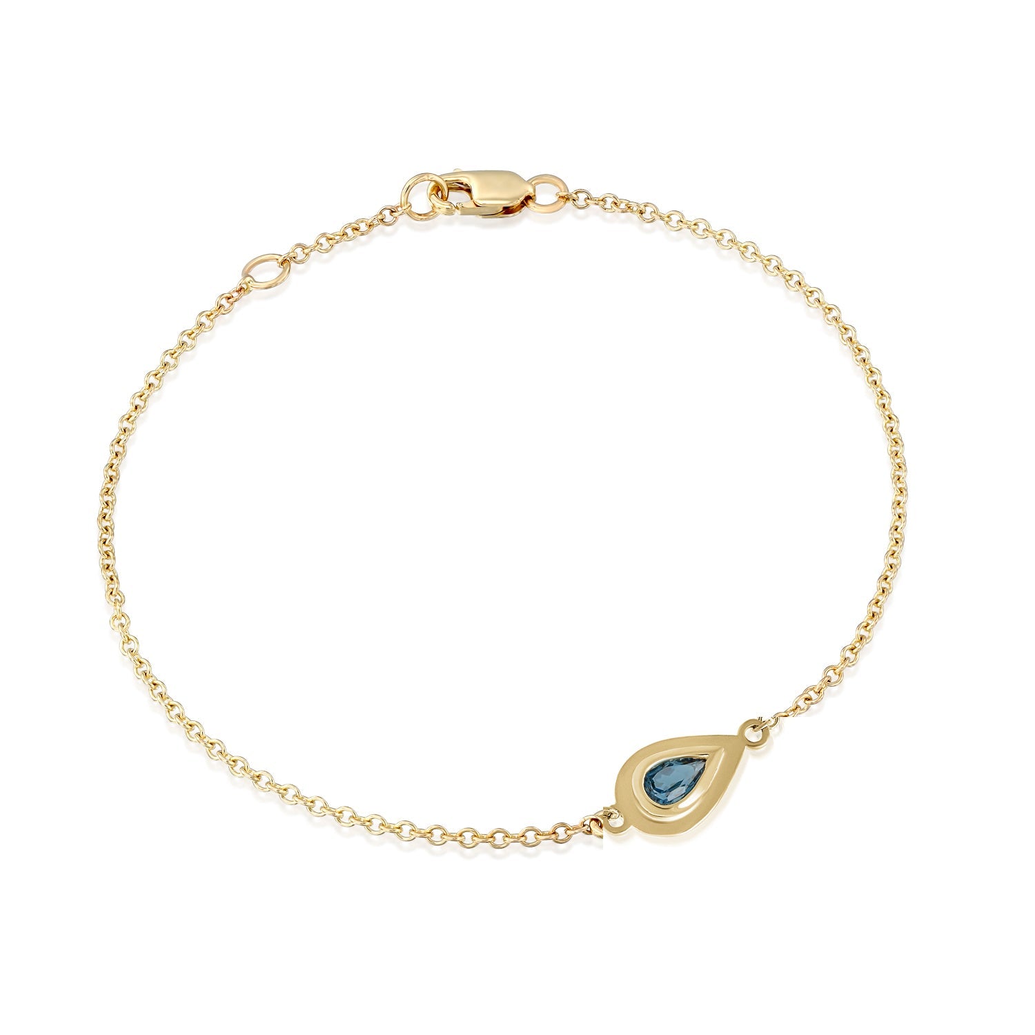 A gold bracelet inlaid with a gold pendant in the shape of a drop and in the center London Blue Topaz