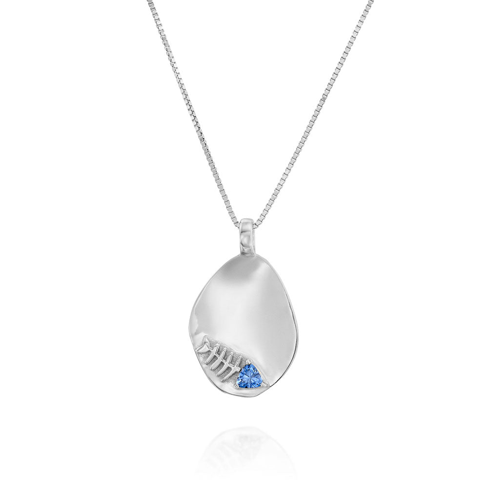 Gold necklace with an amorphous pendant decorated with a fish inlaid with a sapphire stone