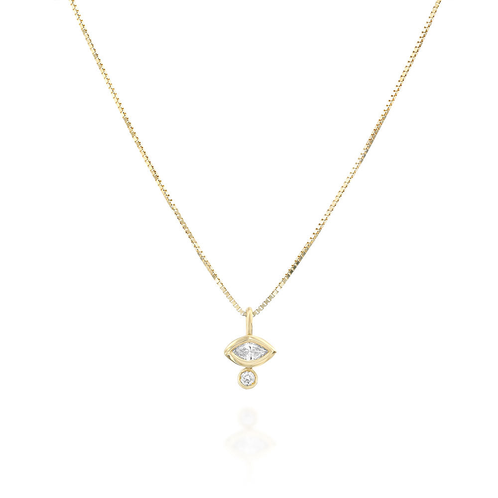 A fine gold chain with a diamond pendant in combination with a marquise-cut diamond (7 points) and a round diamond