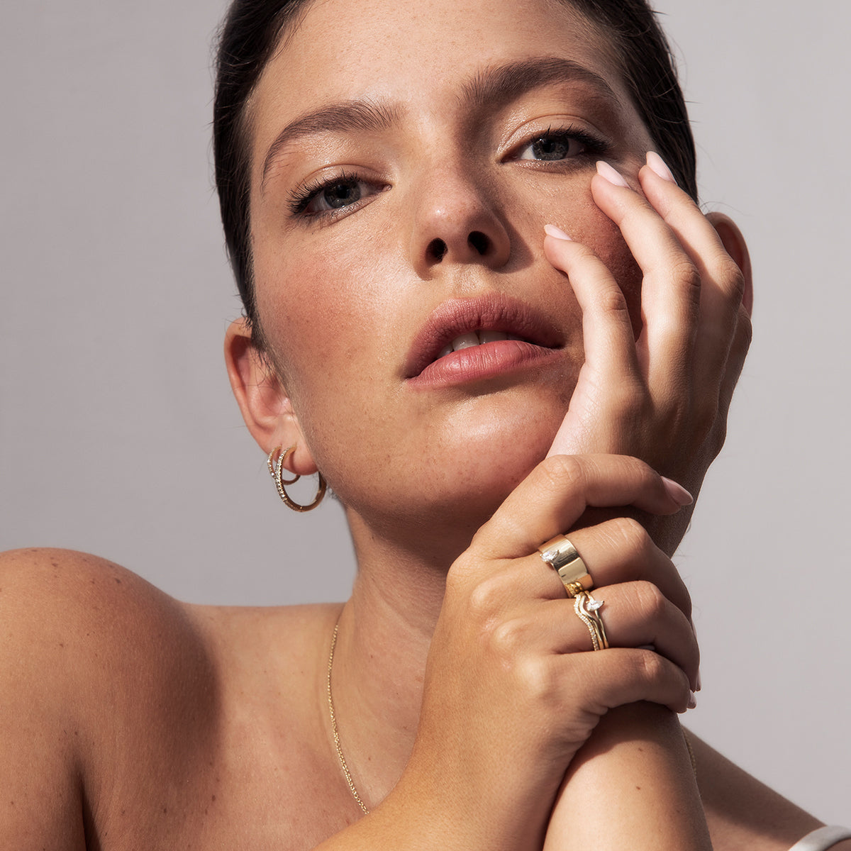 A gold ring with a wave set with diamonds