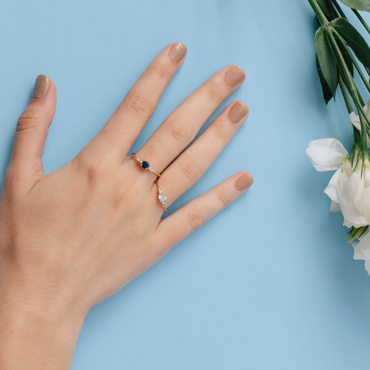Delicate and special engagement ring set with sapphires and diamonds