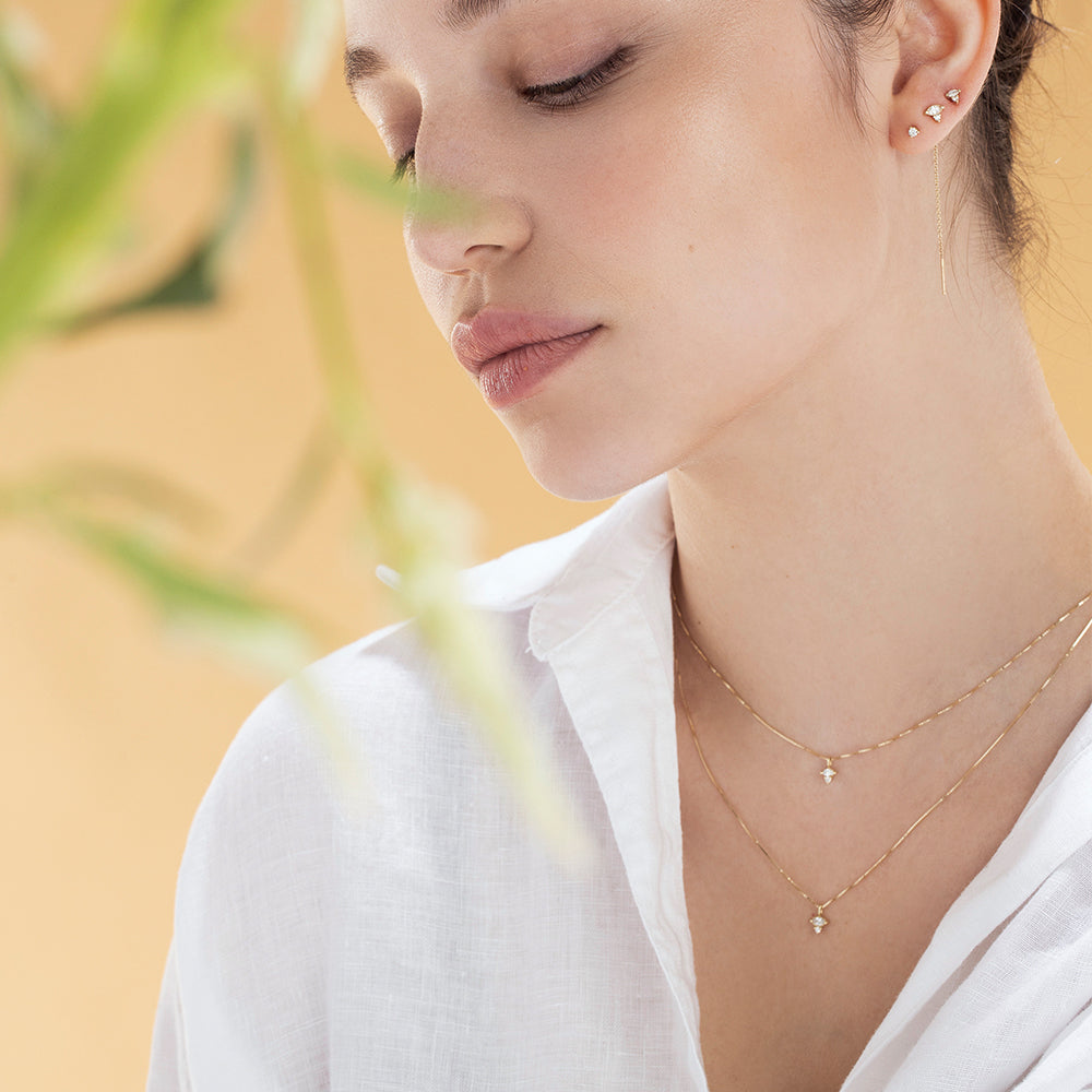 Fine gold chain with a diamond pendant combined with a marquise-cut diamond (7 points) and a round diamond