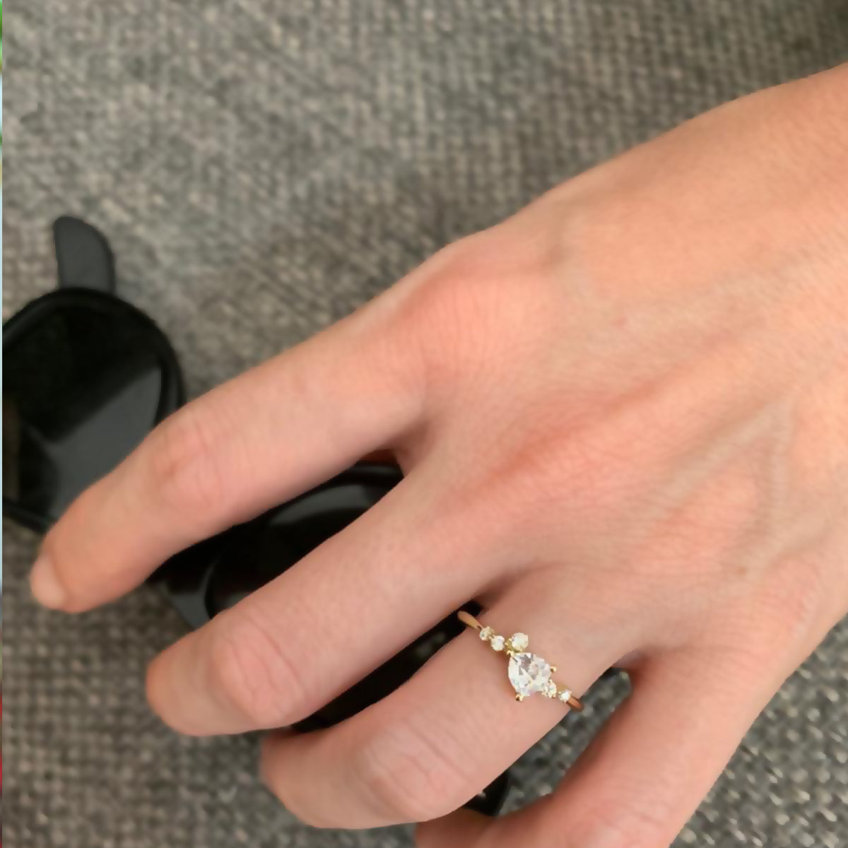 An engagement ring set with a trillion-cut diamond and diamonds all around