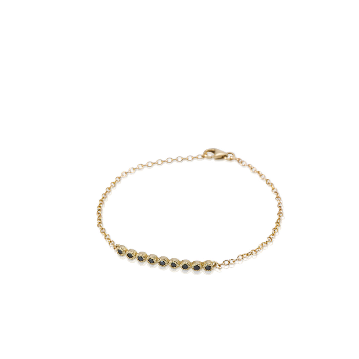 Gold bracelet set with 9 black diamonds