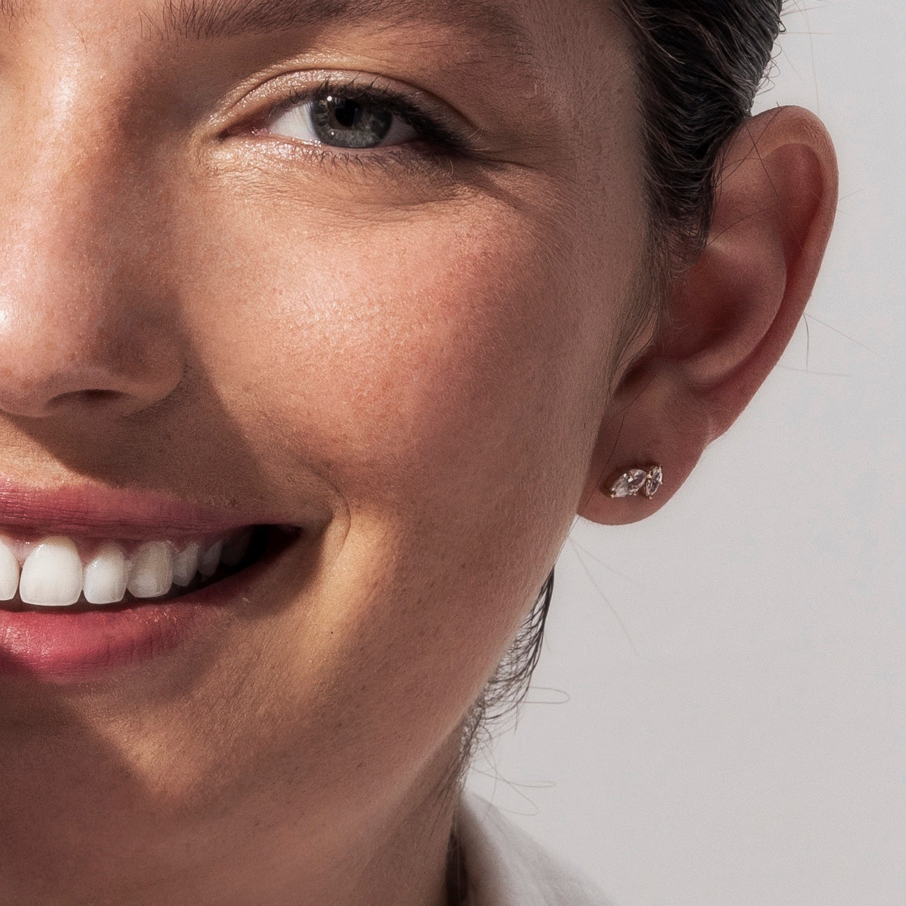 Tight gold earrings set with marquise-cut laboratory diamonds