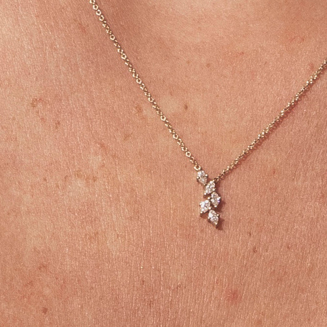 Gold chain with leaf pendant set with marquise-cut diamonds