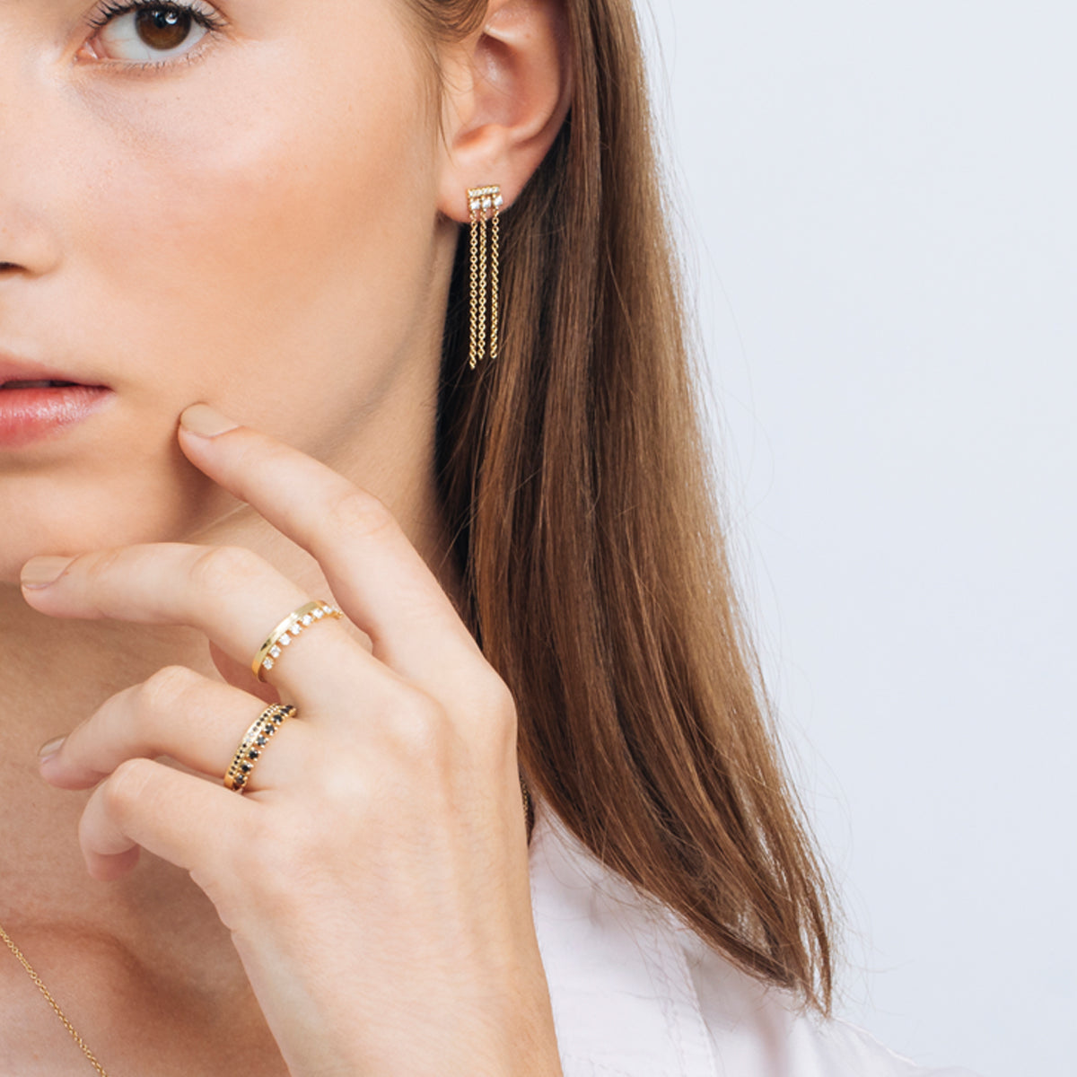 Special gold and diamond earrings combined with swinging necklaces