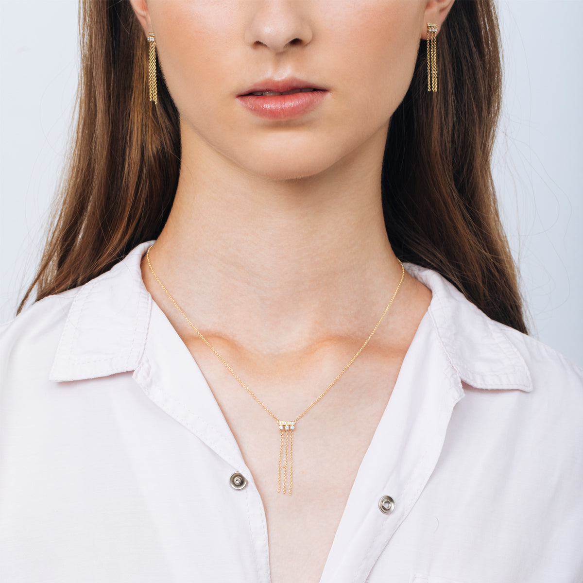 Special gold and diamond earrings combined with swinging necklaces