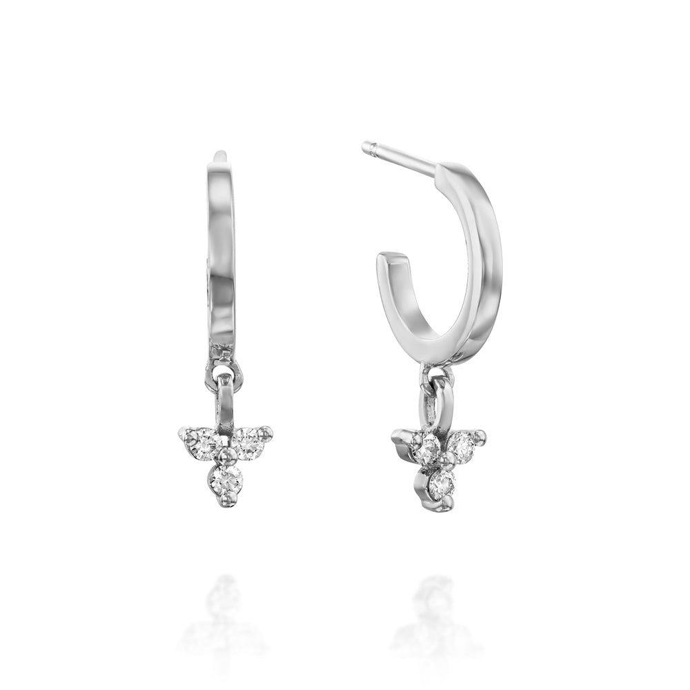 Gold hoop earrings with a triangular pendant with 3 white diamonds