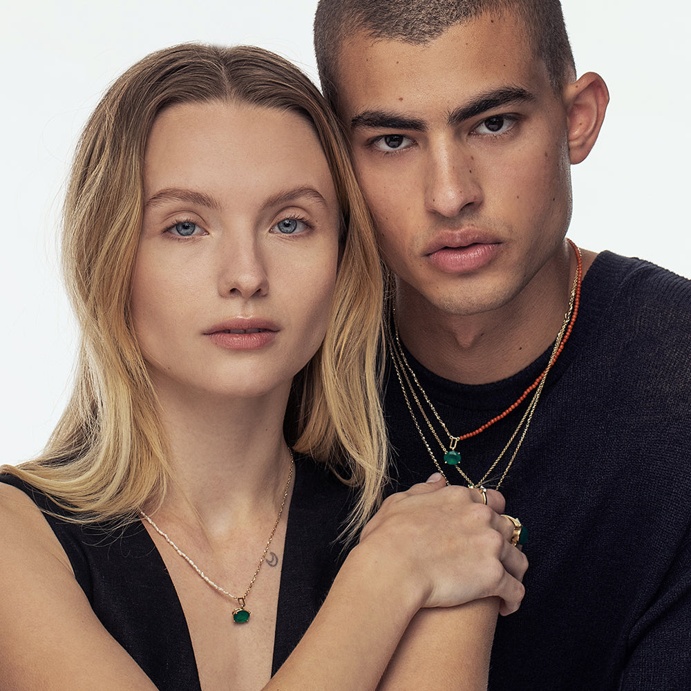 Gold necklace with mother of pearl and oval green onyx