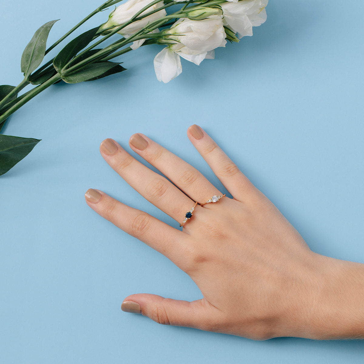 Delicate and special engagement ring set with sapphires and diamonds