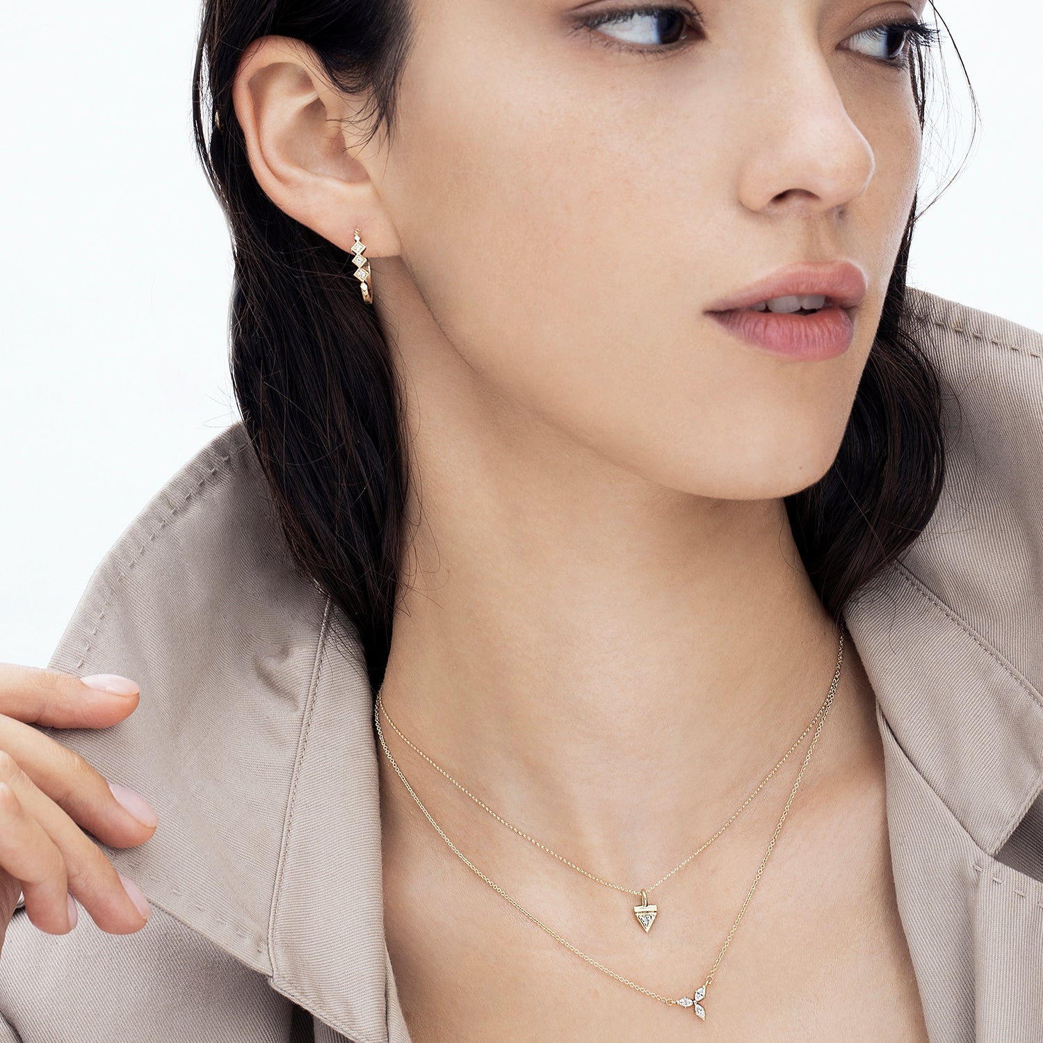 Fine gold chain with a triangle-shaped pendant studded with a 3-point diamond