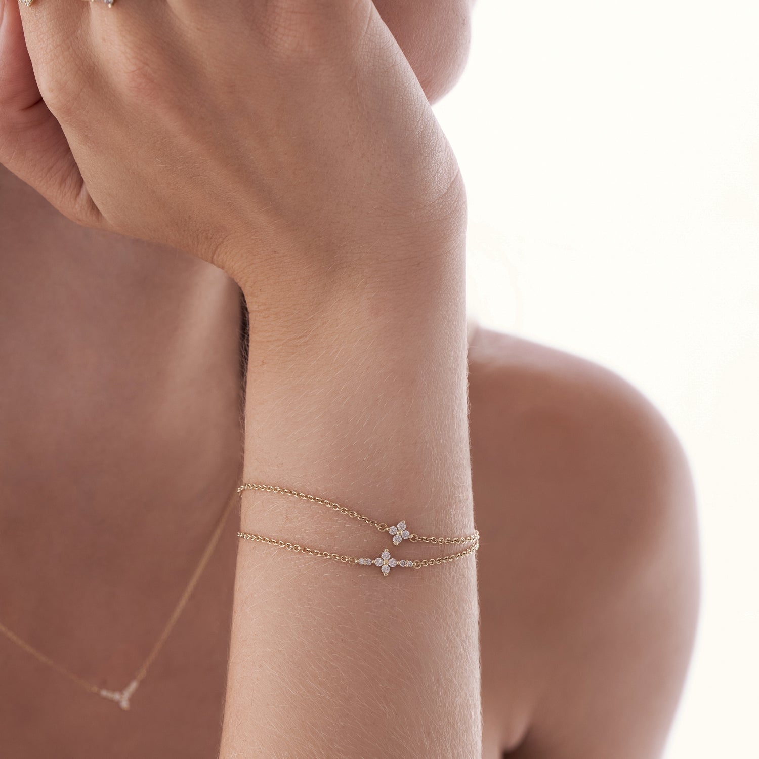 Gold bracelet for women set with 4 diamonds
