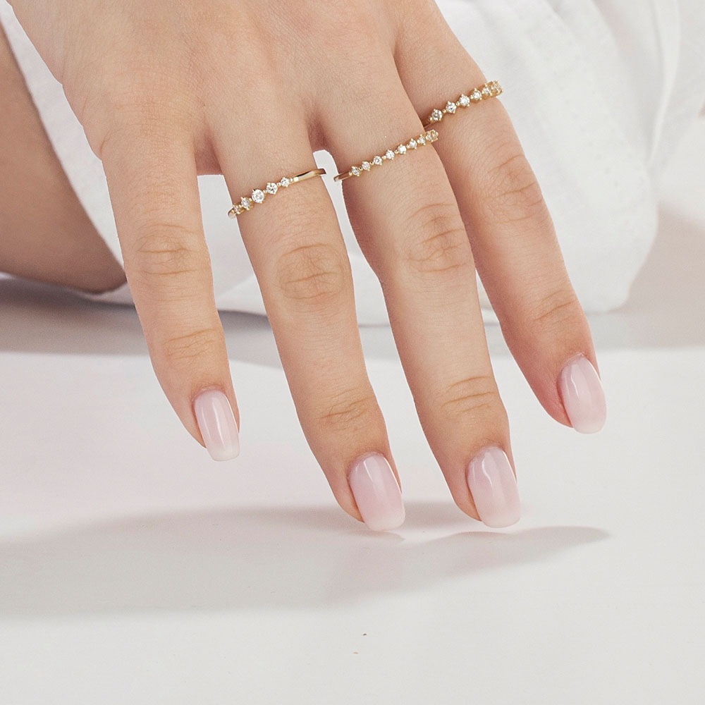 A delicate diamond ring set with 7 diamonds in a special setting