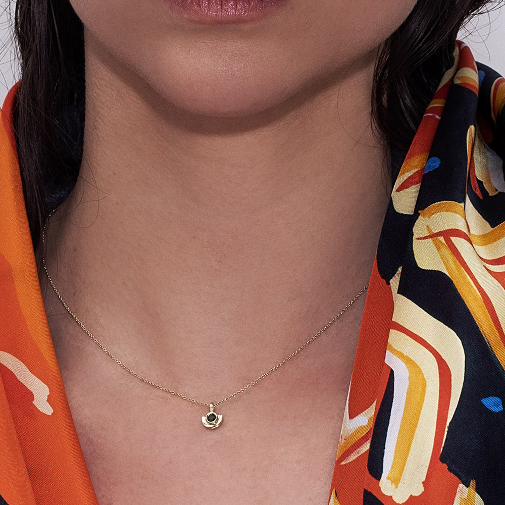 Gold necklace with a special pendant, semi-circular, inlaid with green tourmaline