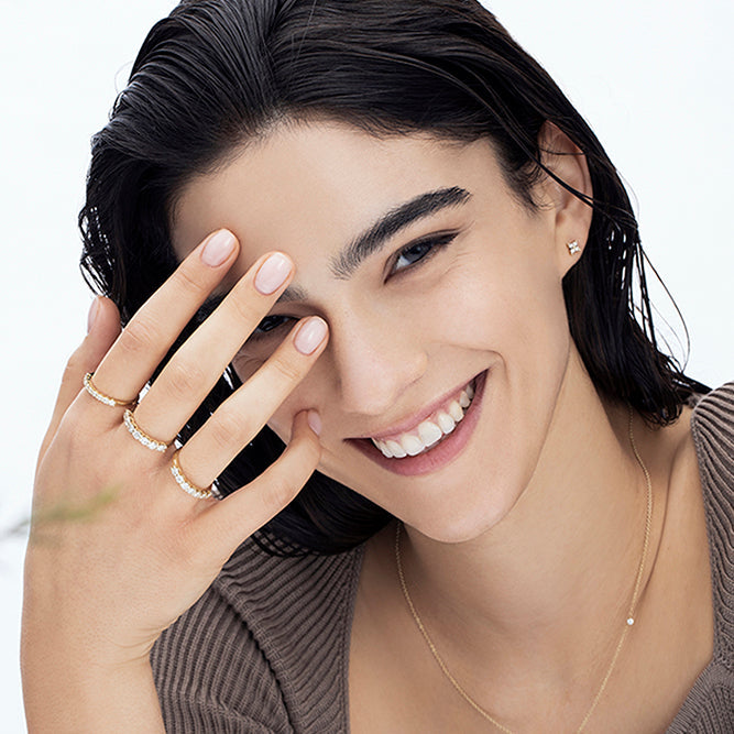 Gold ring set with 7 laboratory diamonds weighing 10 points per diamond, 70 points total