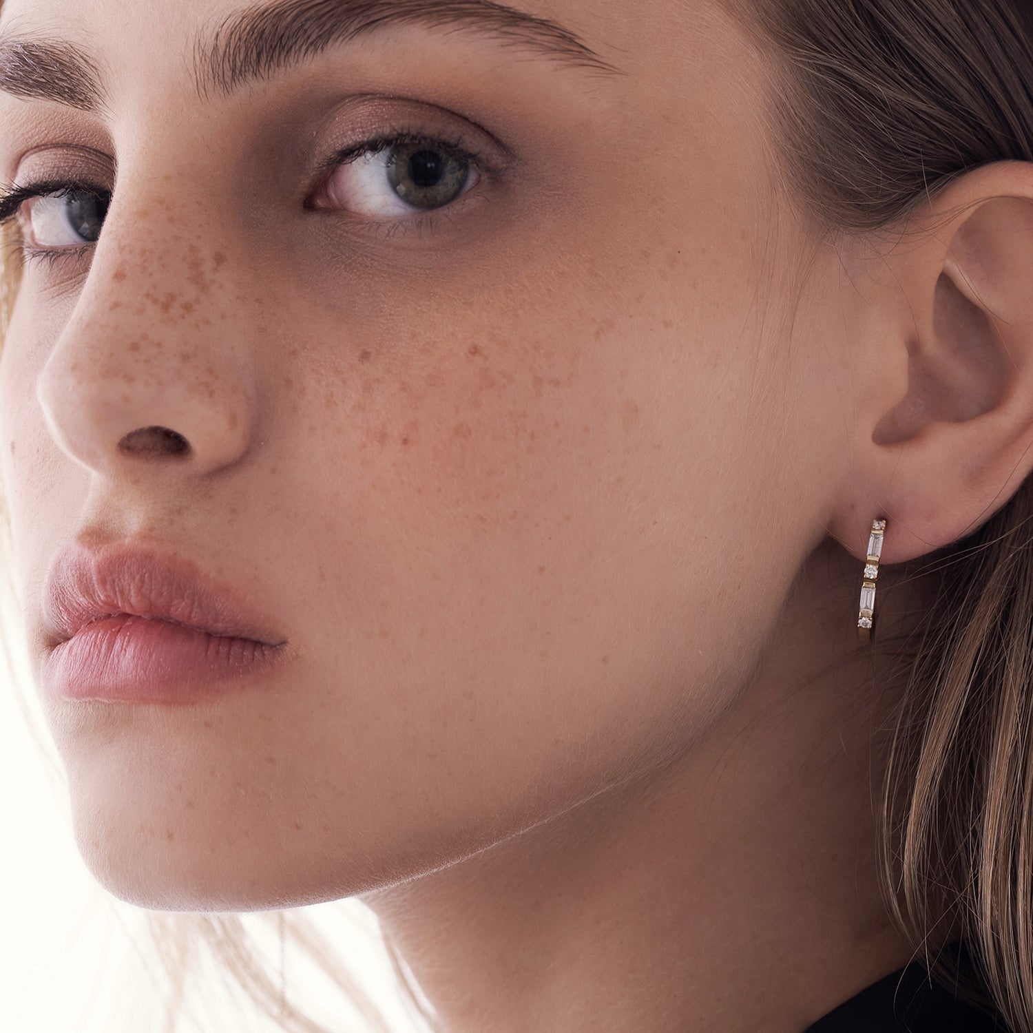 Special gold hoop earrings set with baguette-cut laboratory diamonds