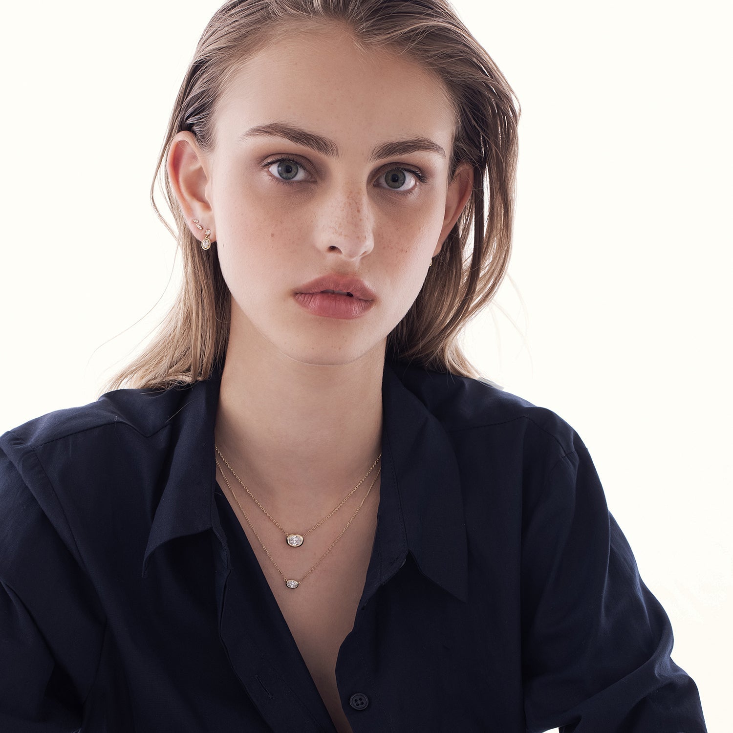 A classic gold necklace set with an oval-cut lab diamond