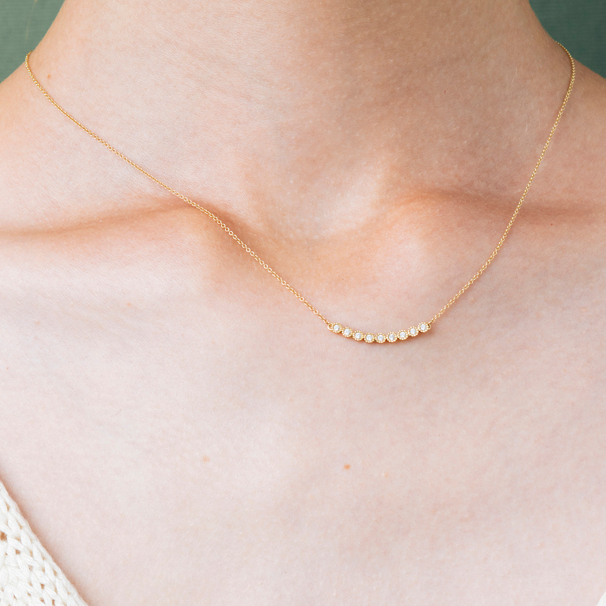 Gold chain and horizontal row of diamonds