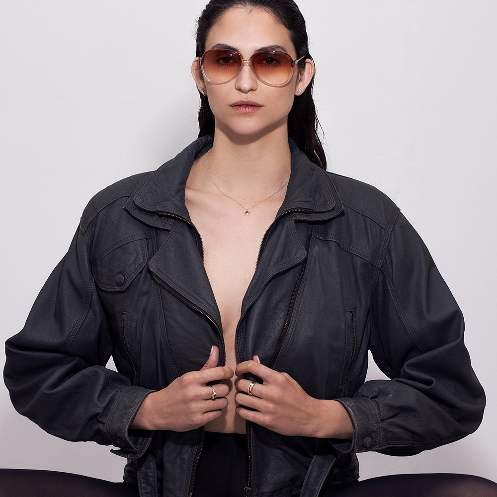 A special gold ring set with rectangular green tourmaline and white diamonds