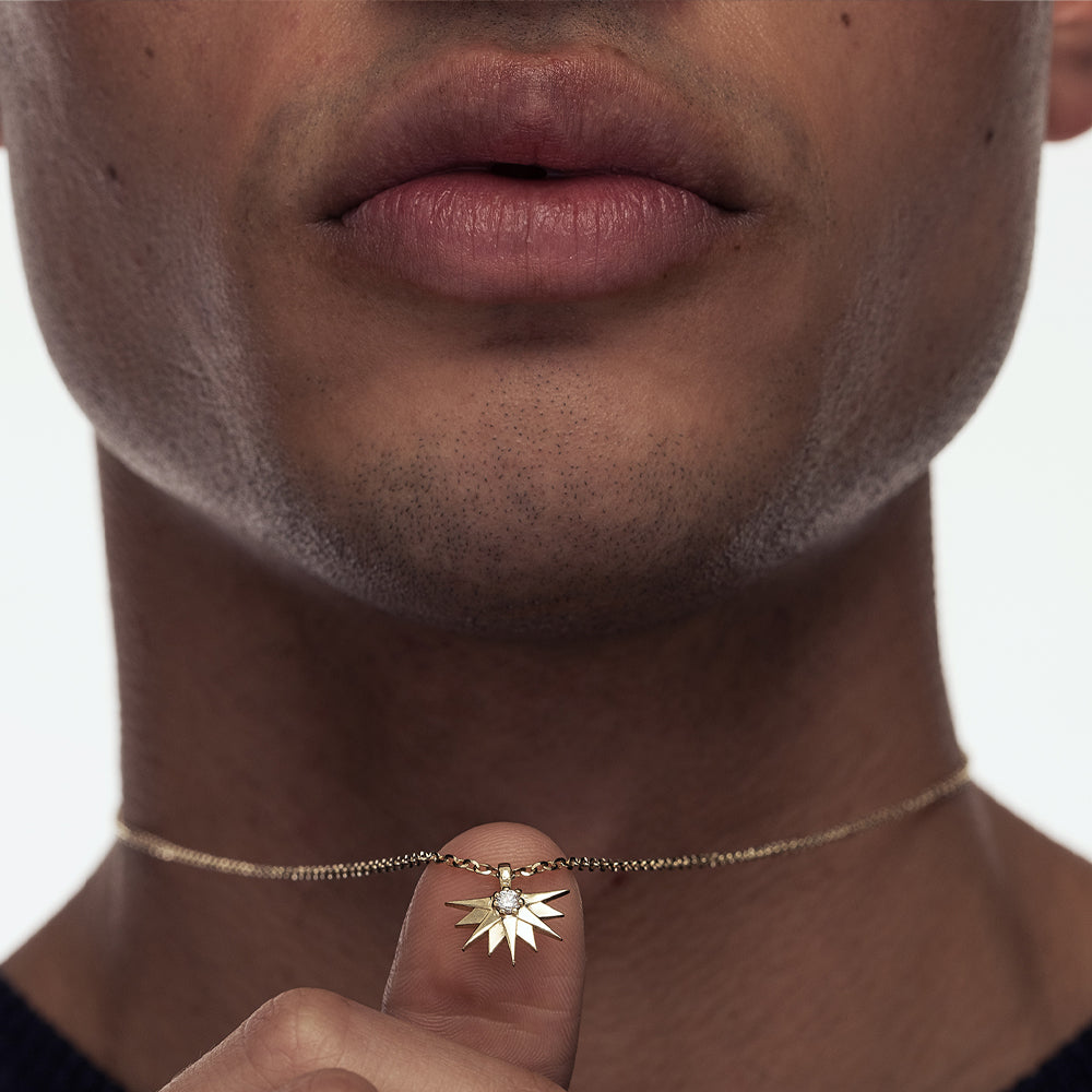 A special gold chain with a large half sun pendant