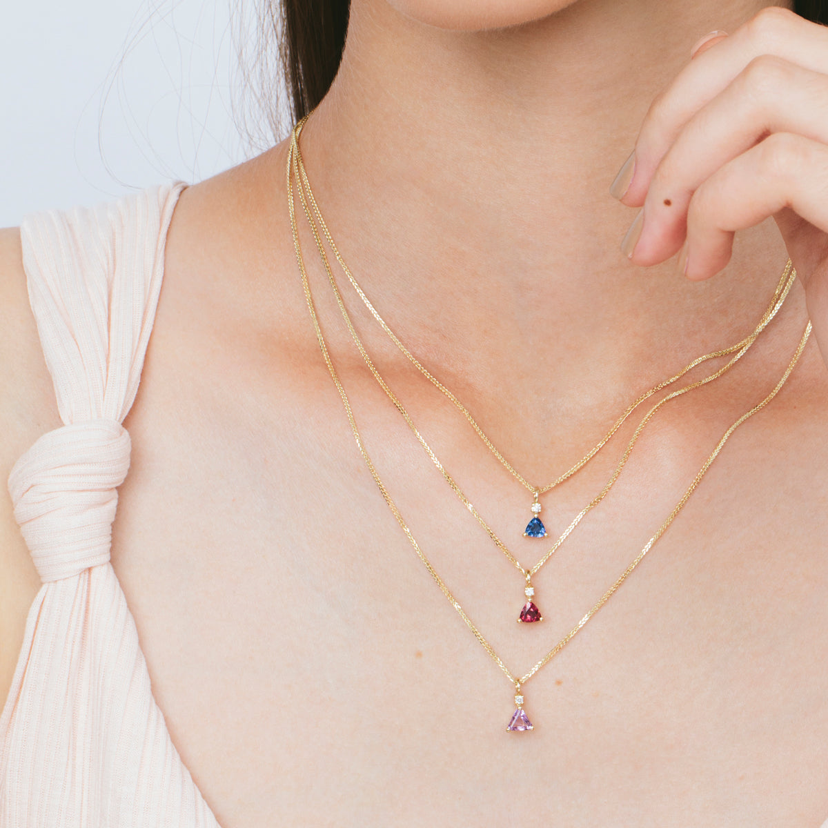 Gold necklace with sapphire and diamond studded pendant
