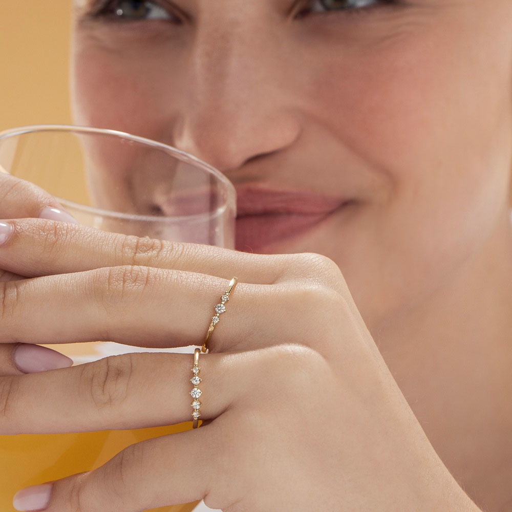 A delicate diamond ring set with 5 diamonds in a special setting