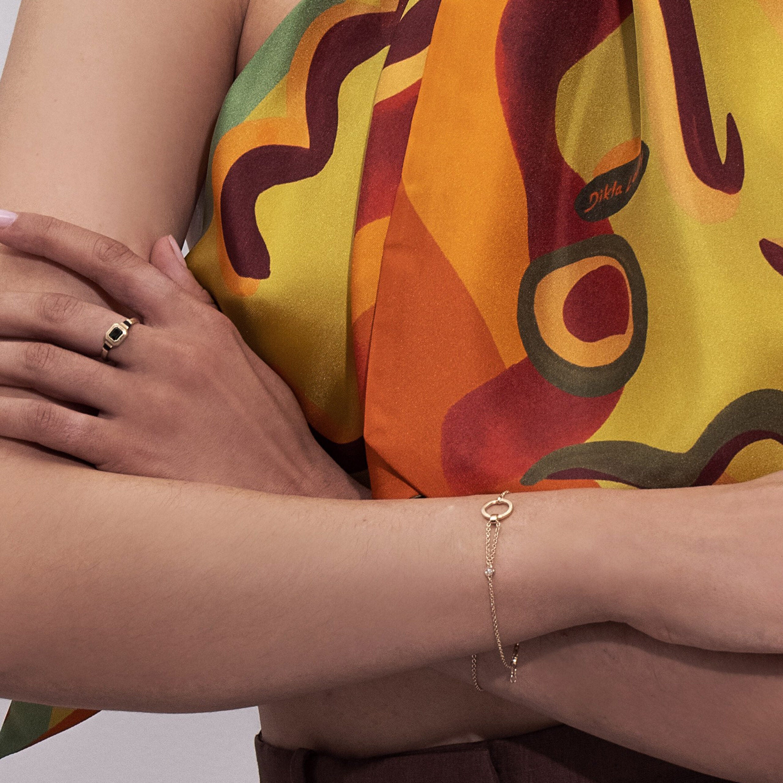 A special asymmetric gold bracelet in a modern and impressive design set with a diamond