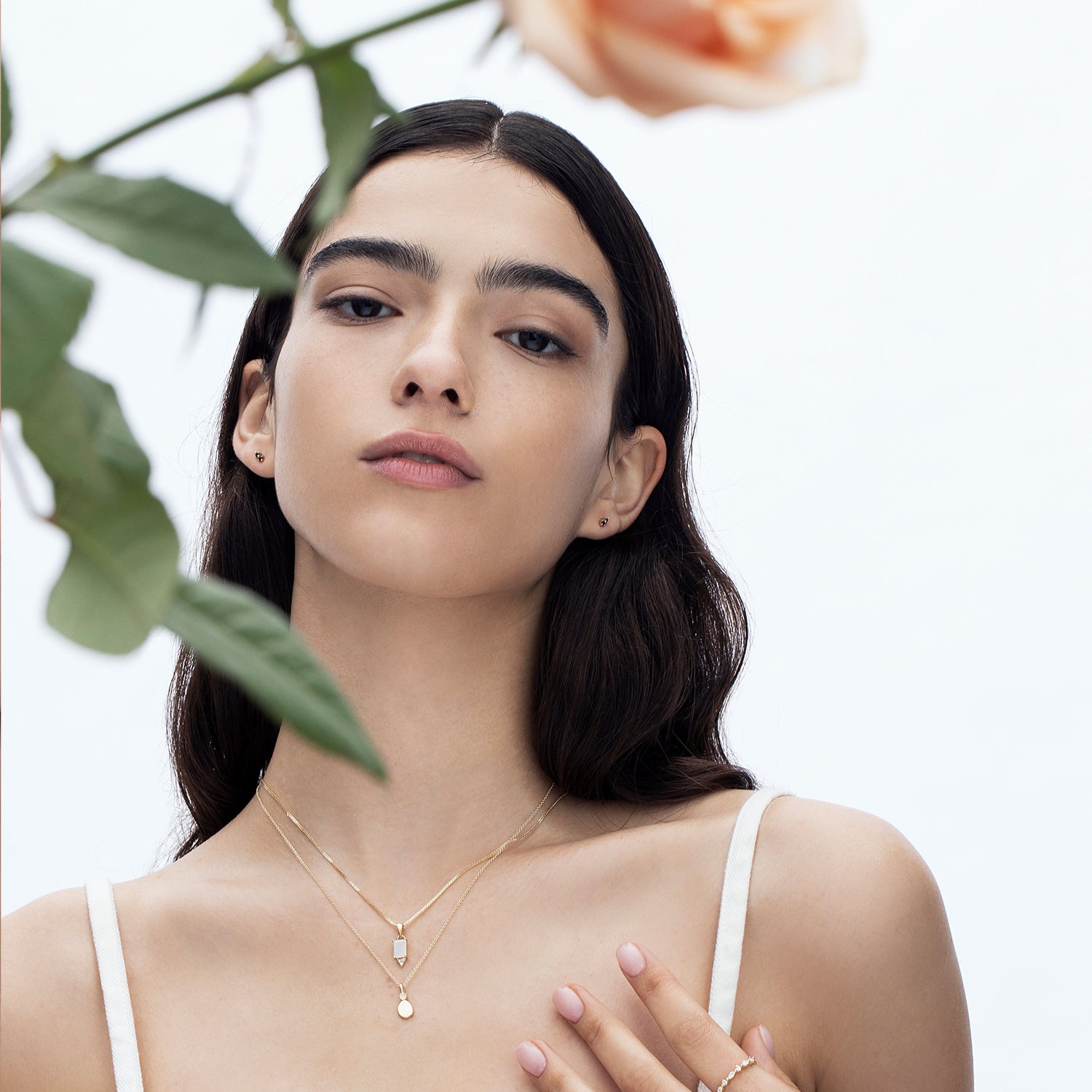 Gold necklace with moonstone inlaid pendant in emerald cut and diamonds