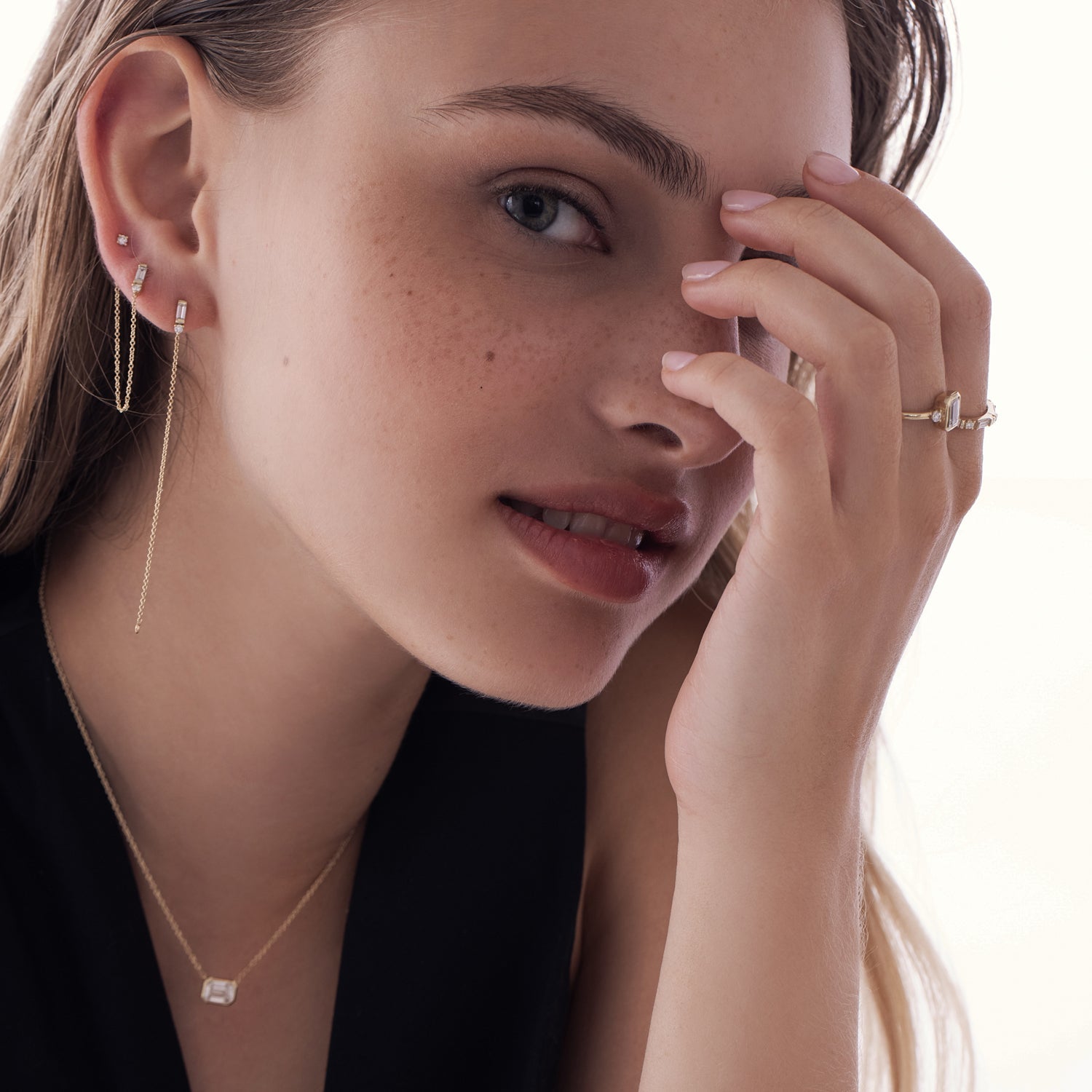 A special gold chain earring set with lab diamonds in a baguette and circle cut